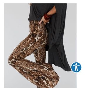 Stretch fabric flare snake skin pants